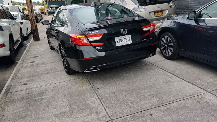 Car driving on sidewalk in Long Island City